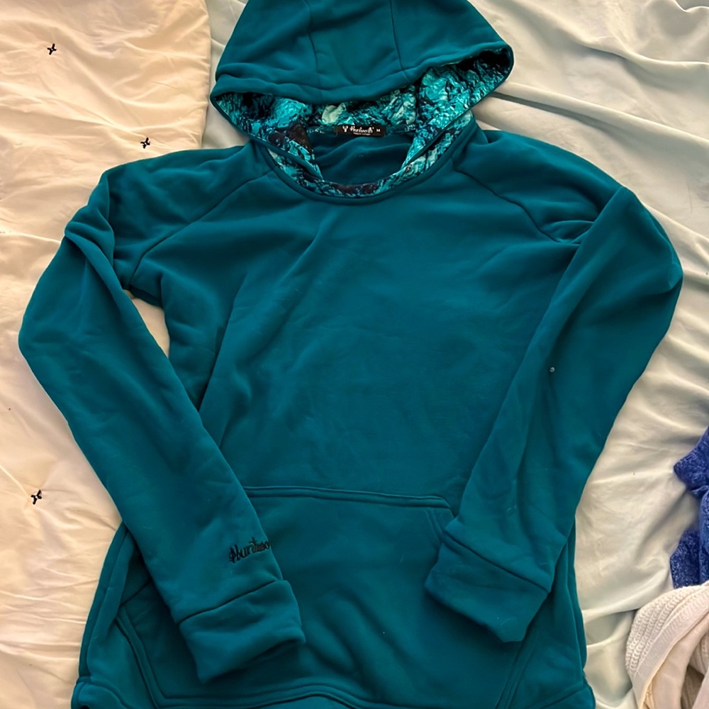 Brand new warm fall winter sweatshirt, dark teal with design in hood